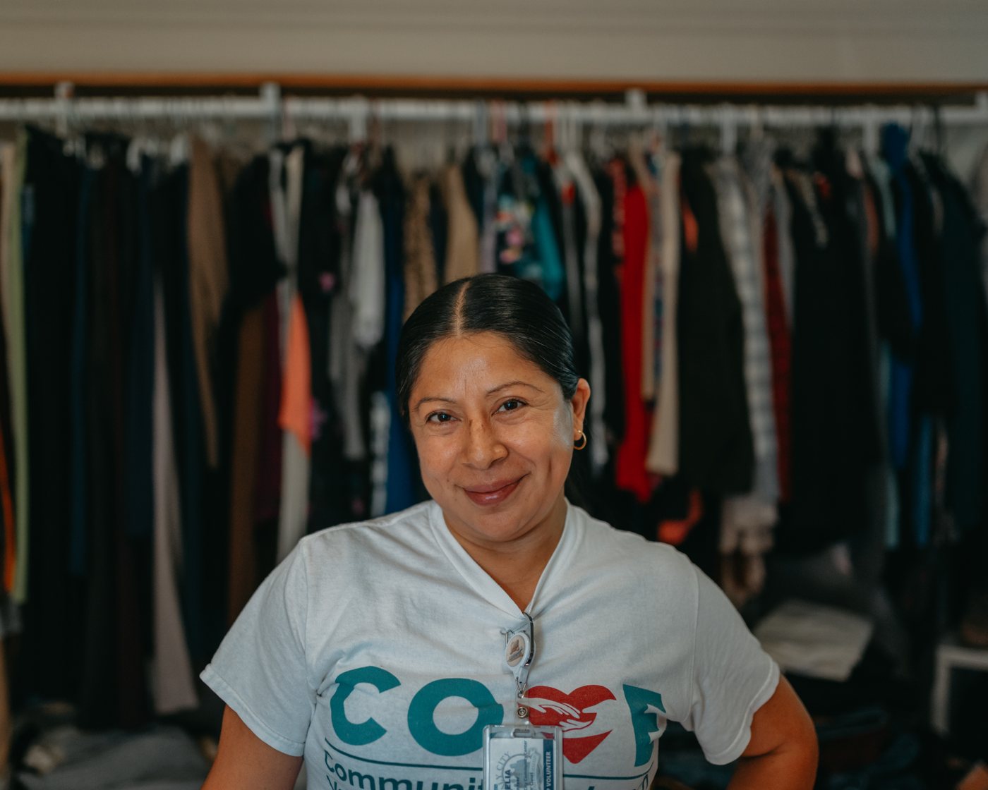 A COVE volunteer at the clothing racks at Pats’ Closet