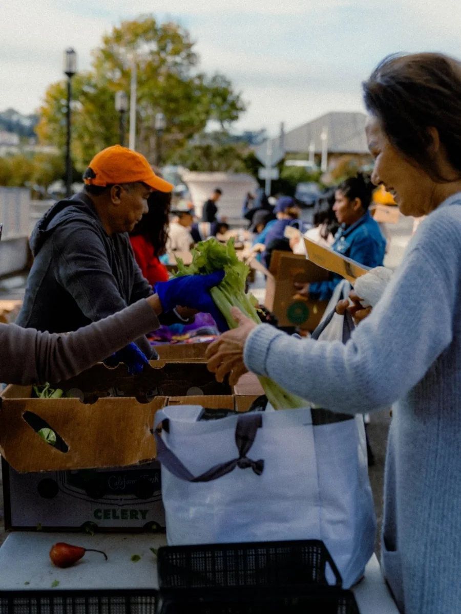 Neighbors picking up fresh produce at the DCP pantry