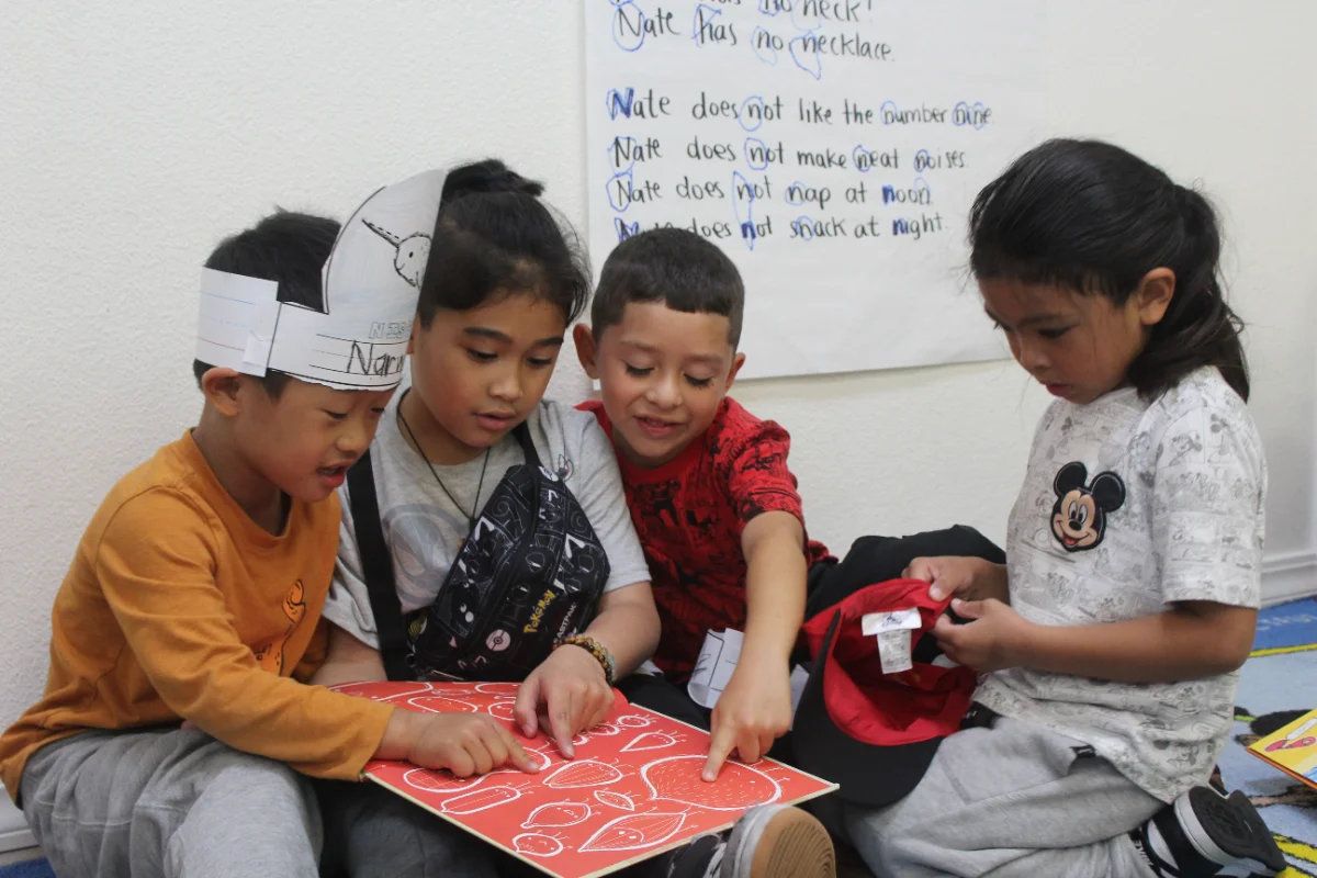 Kids working together at the Our Second Home after-school program, 2026